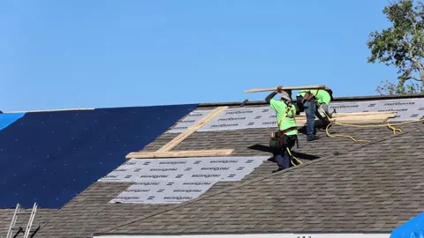 U.S. Army engineer working on blue roof installation Stock Footage 162308319