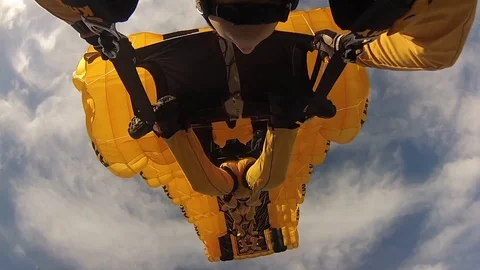 U.S. Army Golden Knights conduct parachute jump in formation Stock Footage 106928580