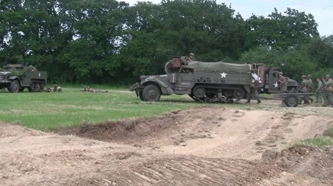 US Army Half Track advances on the battlefield Stock Footage