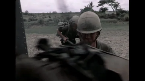 US Army Helicopters Picking Up Ground Troops From Rice Paddies In Vietnam Stock Footage 97605136