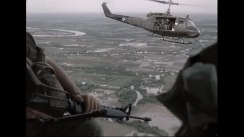 US Army Helicopters Transporting Ground Troops In Flight Over Vietnam Stock Footage 97606282