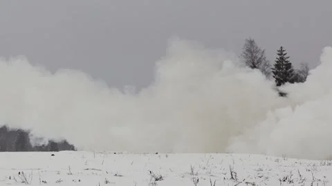 U.S. Army High-Mobility Artillery Rocket System crew launch rockets in snow Stock Footage 260312776