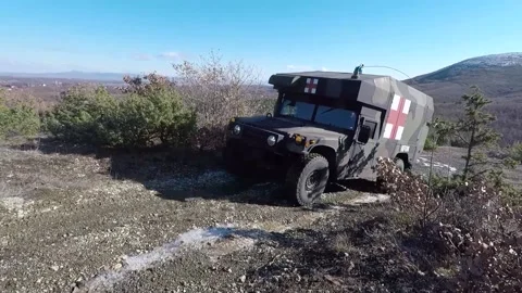 U.S. Army Humvee being driven up mountain track Stock Footage 168232909