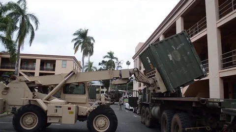 US Army logistics personnel operating a rough terrain container handler Video stock 83320599
