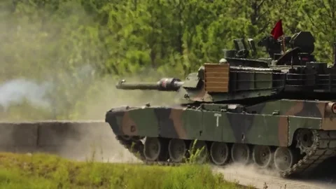 U.S. Army M1 Abrams main battle tank firing cannon and reversing at firing range Stock Footage 280552916