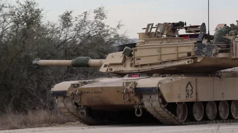 U.S. Army M2A3 Bradley Fighting Vehicle travelling on dirt track Stock Footage 301062959