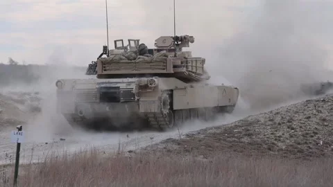 U.S. Army M2A3 Bradley Fighting Vehicle firing its gun during live fire exercise Stock Footage 301063049