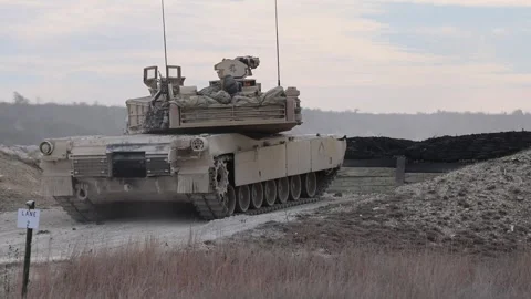U.S. Army M2A3 Bradley Fighting Vehicle discharging its gun at a firing range Stock Footage 301063052