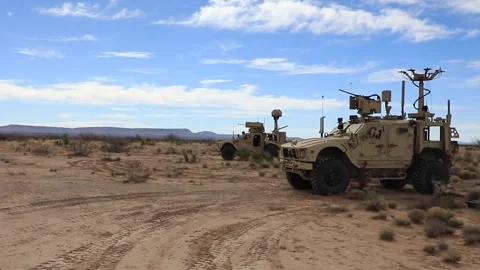 U.S. Army Oshkosh JLTV Heavy Guns Carrier firing MK 19 grenade launcher Stock Footage 266894216