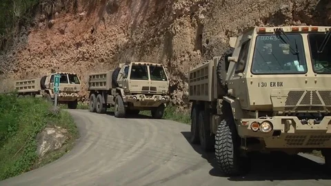 US Army Oshkosh trucks working at damaged Guajataca Dam Vidéo 81703785