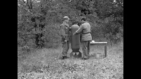 US Army Propaganda Warfare Techniques Men Carry Leaflet Bomb Stock Footage 94297287