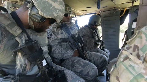 U.S. Army Security Forces soldiers onboard UH-60 Black Hawk helicopter Stock Footage 111811799