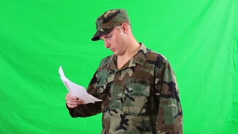 U.S. Army Serviceman Reading Bad News From a Letter Stock Footage 98255880