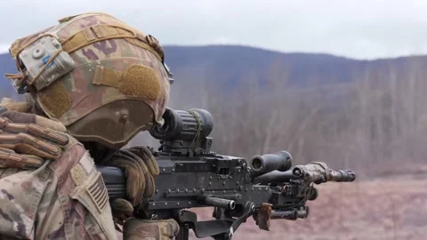 U.S. Army sniper fires machine gun during live fire exercise Stock Footage 235787857