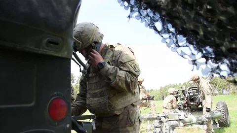 U.S. Army soldier receiving co-ordinates over radio Stock Footage 89608700