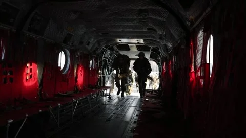 U.S. Army soldiers boarding CH-47 Chinook helicopter Stock Footage 295350191