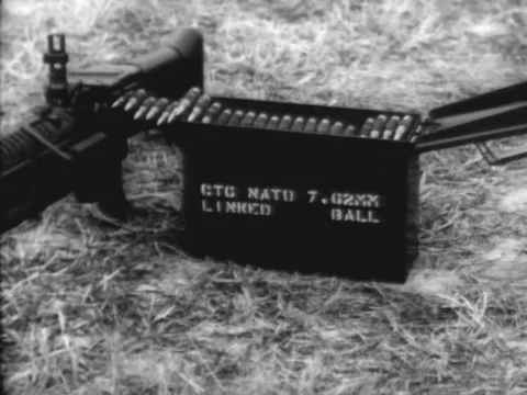 U.S. Army soldiers shoot with a machine gun, 7.62mm, M60, operating in the Stock Footage