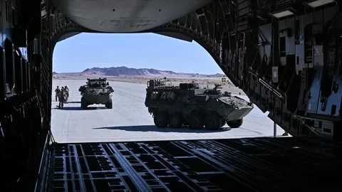 U.S. Army Strykers loading onto U.S. Air Force C-17 Globemaster III Stock Footage 263189633