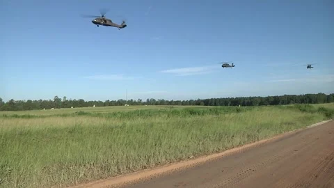 U.S. Army UH-60 Black Hawk helicopters flying during field exercise Stock Footage 280470037