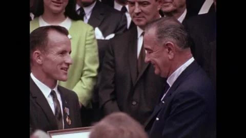 U.S. Astronaut Edward White receiving medal from President Lyndon B Johnson Stock Footage 263418522