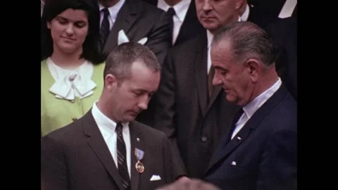 U.S. Astronaut James McDivitt receiving medal from President Lyndon B Johnson Stock Footage 263418529