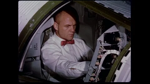U.S. astronaut John H. Glenn checking out spacecraft controls Stock Footage 263292207