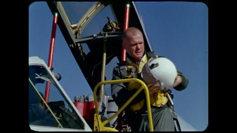 U.S. Astronaut John H. Glenn posing for photo on Convair F-102 aircraft Stock Footage 263292302
