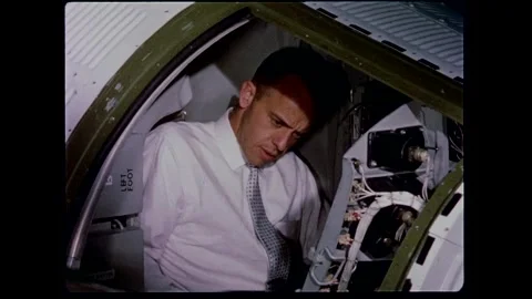 U.S. Astronaut Lt. Comdr. Alan B. Shepard Jr checking out spacecraft controls Stock Footage 263292179