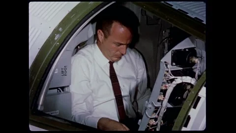 U.S. Astronaut Lt. M. Scott Carpenter checking out spacecraft controls Stock Footage 263292191