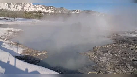 US: Black Diamond Pool Erupts In Winter Spectacle At Yellowstone Stock Footage 324762174