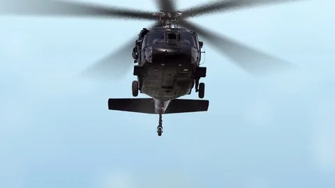 US Blackhawk Helicopter flying in blue sky with clouds and propeller blades 스톡 동영상 73753029