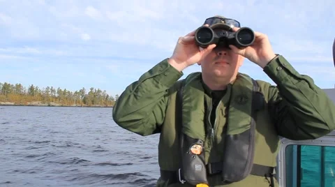 US Border Agent Looks Through Binoculars (HD) co Stock Footage 954453