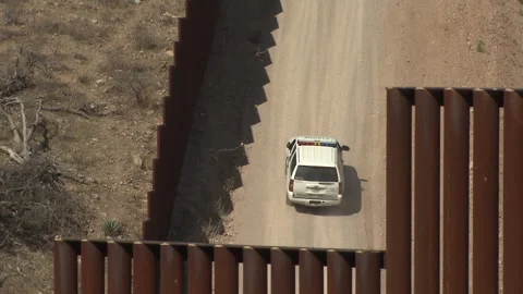 US Border Patrol checking the fence along the US and Mexican border Video stock 130942664