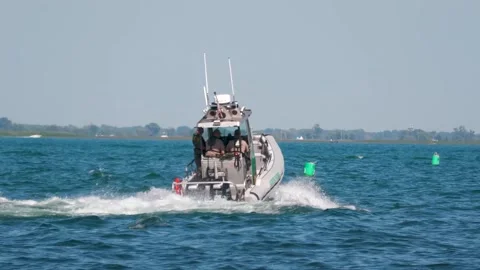 US Border Patrol Small Boat Accelerating Close-Up on Lake St Clair Stock Footage 343793139