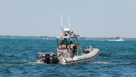 US Border Patrol Small Boat at No-Wake Speed Close-Up on Lake St Clair Stock Footage 343793143