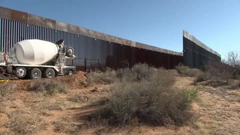 US builds black-painted wall on border with Mexico to deter migrants from climbi Video stock 330965512