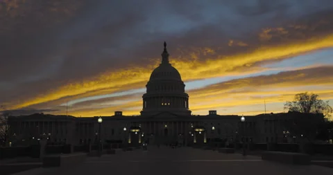 US Capitol against Dramatic Sunset Stock Footage 334703303