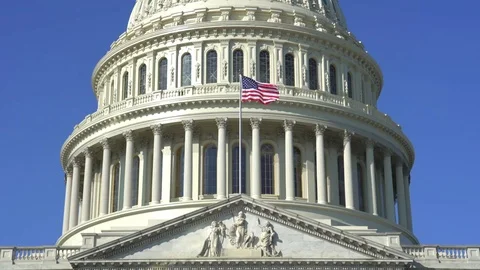 Us Capitol building with flag - Washington DC Stock Footage 71090191