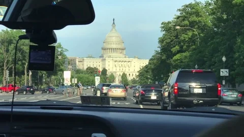 US Capitol driving shot. Capitol Building seen from an Uber Stock Footage 79913307