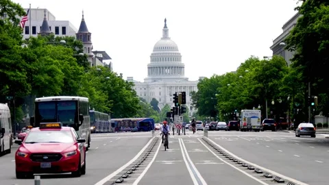 U.S. Capitol Mid Summer Cyclist Stock Footage 170910005