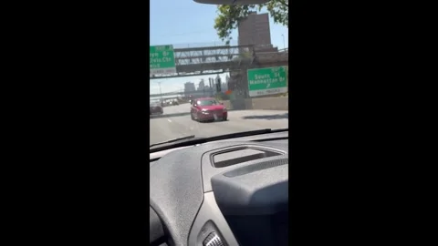 US: Car drives in reverse on highway in Manhattan, New York, USA Stock Footage 320600798