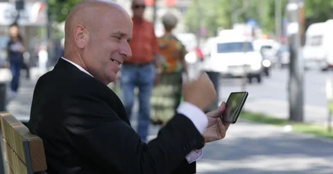 Us City Crowd Sidewalk Bench Work Break Happy Businessman Read Tablet Good News Stock-Footage 54998310