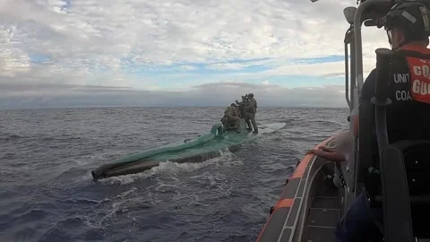 U.S. Coast Guard on board intercepted semi-submersible suspect smuggling vessel Stock Footage 263720808