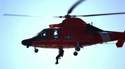 US Coast Guard Helicopter Performing Rescue Mission Video stock 56261729