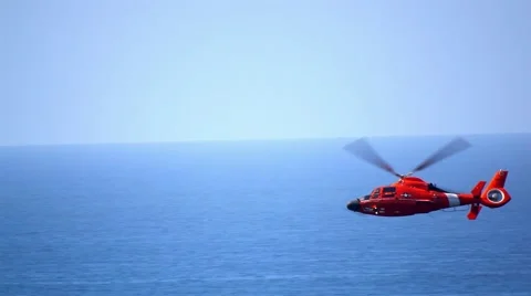 US Coast Guard Helicopter Performing Rescue Mission Stock Footage 56264050