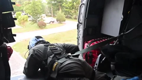 U.S. Coast Guard looking out from helicopter during landing Vidéo 160106719