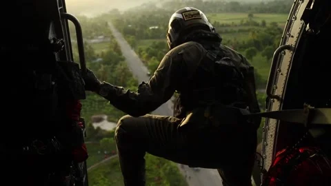 U.S. Coast Guard looking out from helicopter above Haiti Stock Footage 160107924