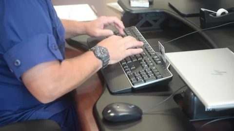 U.S. Coast Guard medic typing on computer keyboard Video stock 211806399
