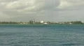 US Coast Guard Patrol Boat - wind mills - electric power station harbor bay HD Footage