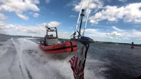 U.S. Coast Guard pursuing vessel during training Stock Footage 213580662